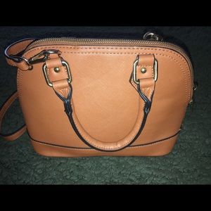 Brown hand bag with cross body strap